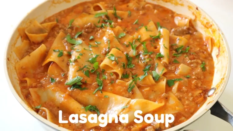 Easy Lasagna Soup Recipe 5 Hearty lasagna soup in a bowl topped with ricotta, melted mozzarella, and fresh basil