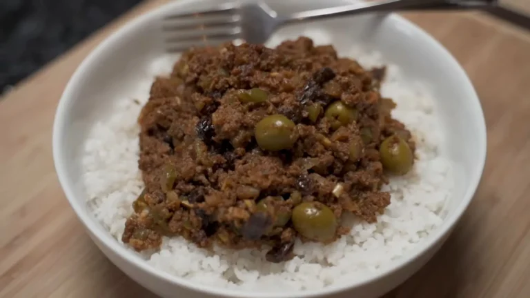 Easy Picadillo Recipe 9 Picadillo served over rice with plantains